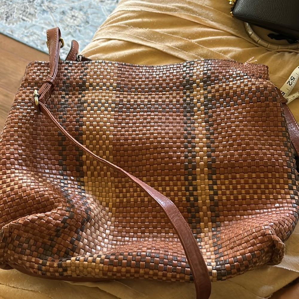 Brown woven shoulder bag with over the shoulder handle option